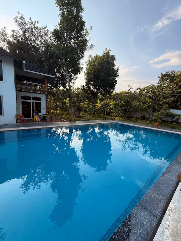 Private swimming pool with tropical garden setting